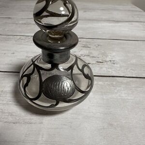 Sterling silver overlay glass perfume bottle with monogram.